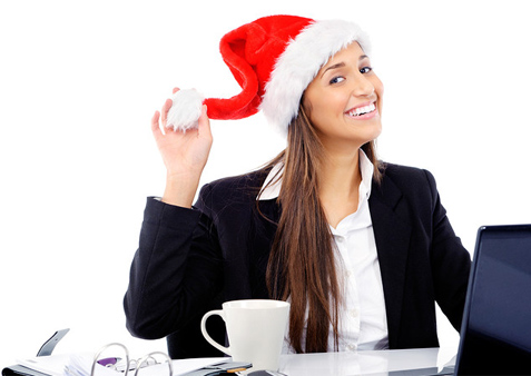 Lady in office wearing a Santa hat
